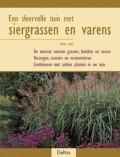 Een sfeervolle tuin met siergrassen en varens